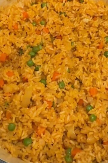 Saffron rice with veggies in a pot.